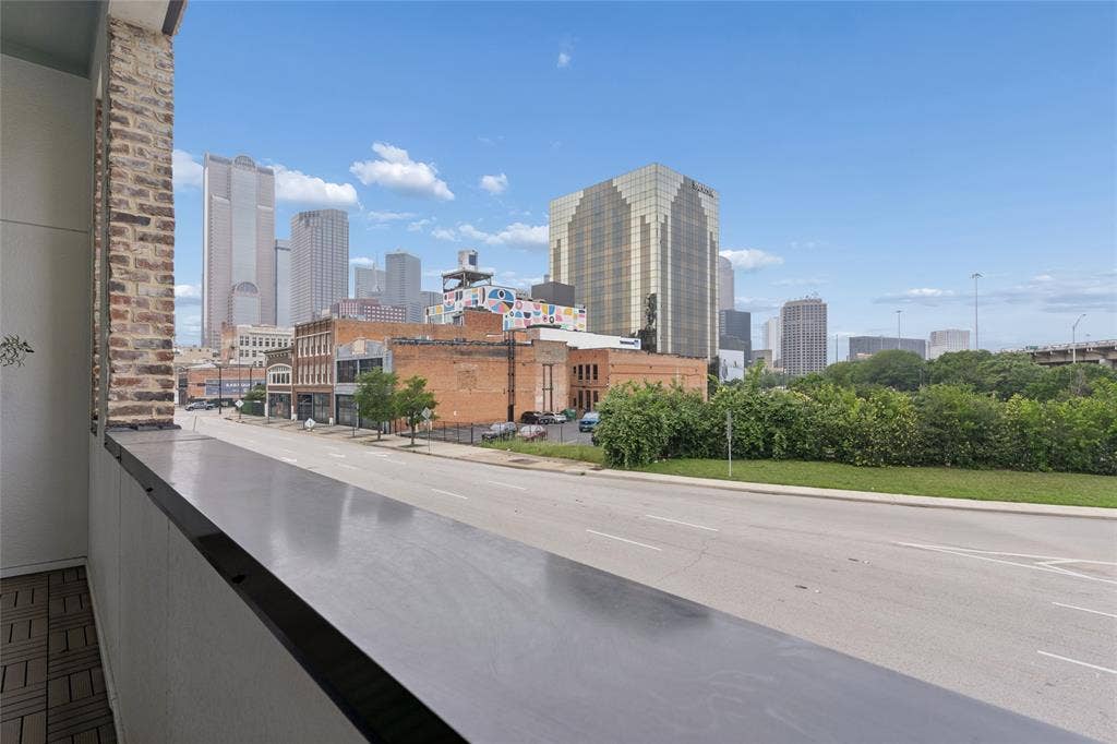 2401 Canton Street, #1002, Dallas, TX 75201 View from second floor balcony. Image of model home with similar layout.