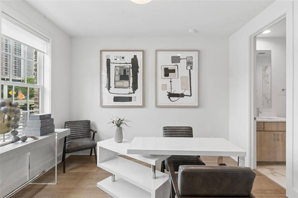 2401 Canton Street, #1002, Dallas, TX 75201 The spacious first-floor bedroom offers privacy and flexibility, ideal for guests or a home office. Image of model home with similar layout.