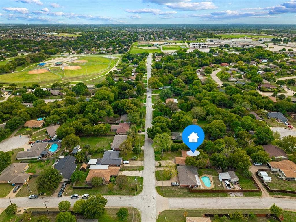 203 Evelyn Street, DeSoto, TX 75115 Aerial perspective of property featuring a mature tree canopy, and established neighborhood grounds
