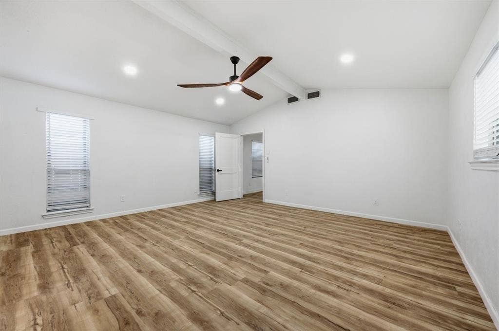 203 Evelyn Street, DeSoto, TX 75115 Note the vaulted ceiling in this spacious primary bedroom