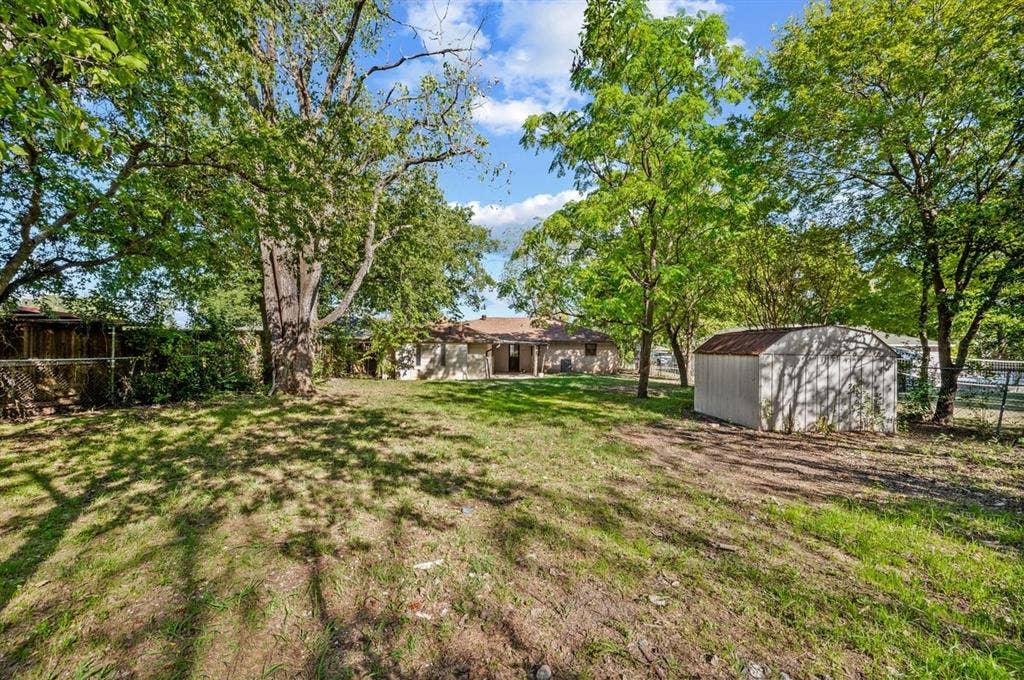 203 Evelyn Street, DeSoto, TX 75115 Large backyard with storage shed. Plenty of room for a garden AND for kicking around the soccer ball with the kids!