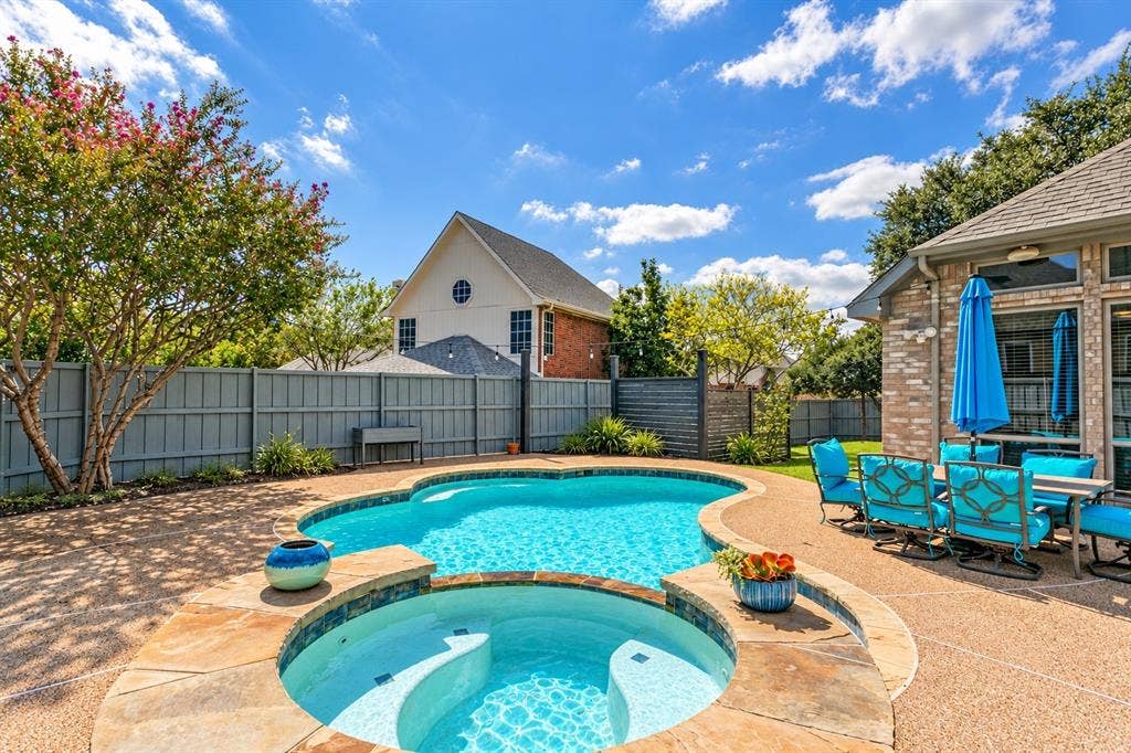 Heated pool and spa with extended pool decking.