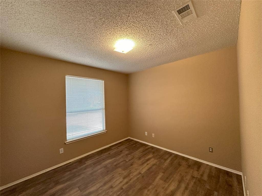 7800 Crestview Drive, Plano, TX 75024 Wood-finish flooring, single window with blinds, ceiling-mounted light fixture, neutral wall palette