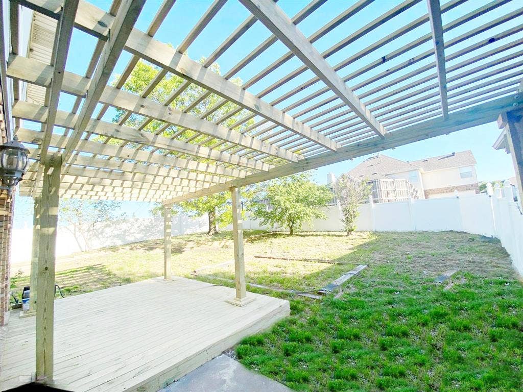 1700 Shiprock Drive, Plano, TX 75025 View of yard featuring a pergola