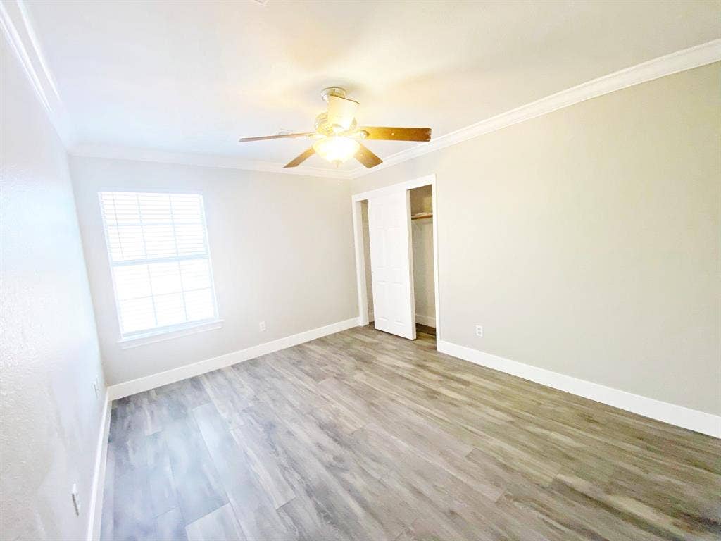 1700 Shiprock Drive, Plano, TX 75025 Spare room with ceiling fan, crown molding, and hardwood / wood-style flooring
