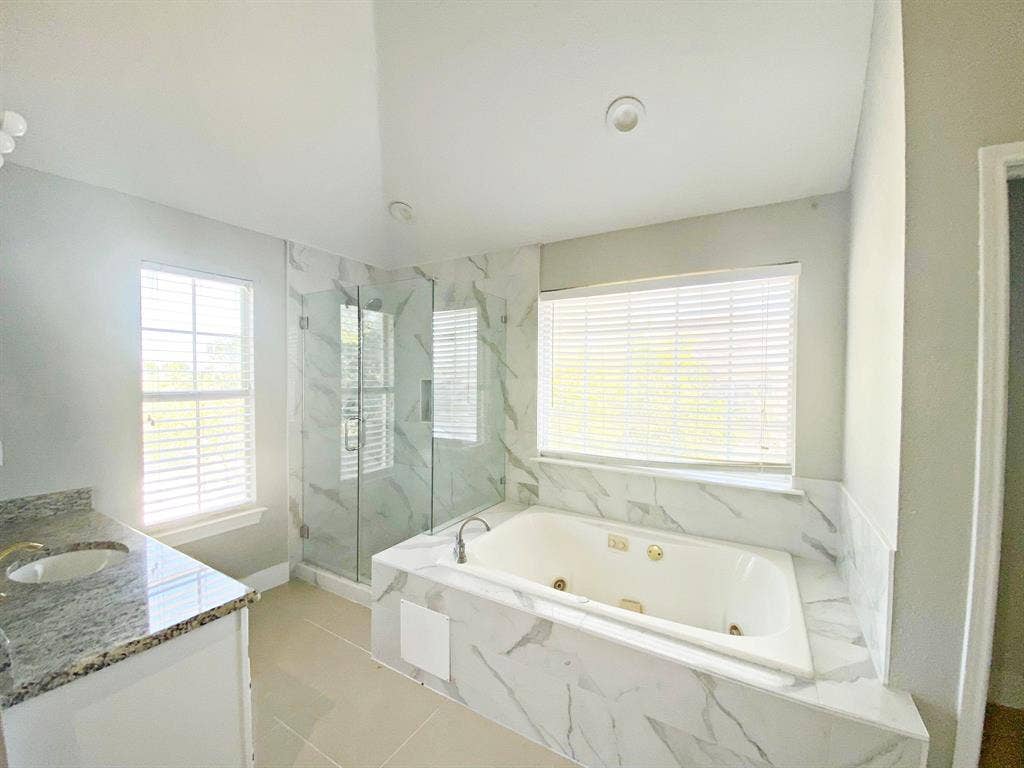 1700 Shiprock Drive, Plano, TX 75025 Bathroom with tile flooring, vanity, and plus walk in shower