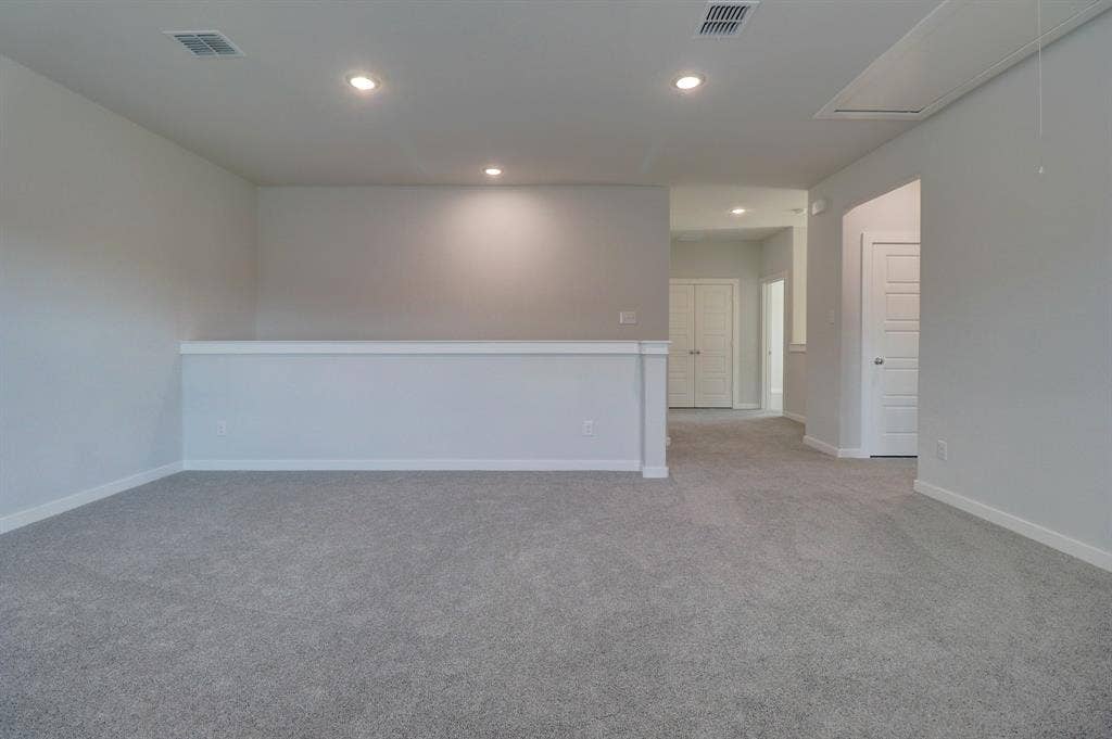 Neutral-toned carpeting throughout