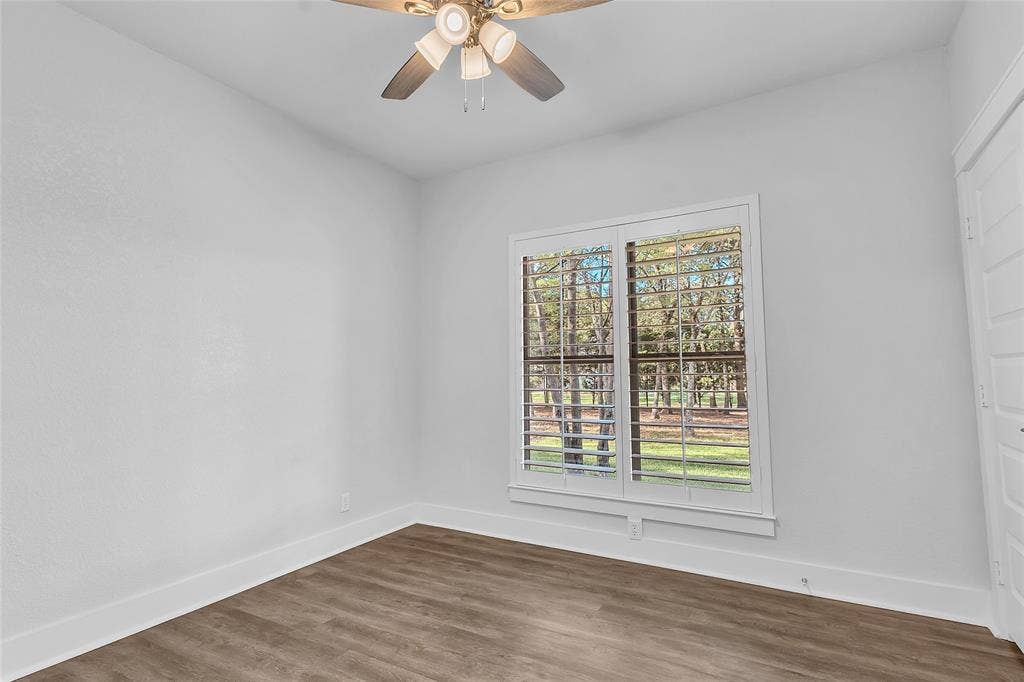 239 Colonial Drive, Mabank, TX 75156 Bedroom 2 offers ample closet space, natural light and a golf course view