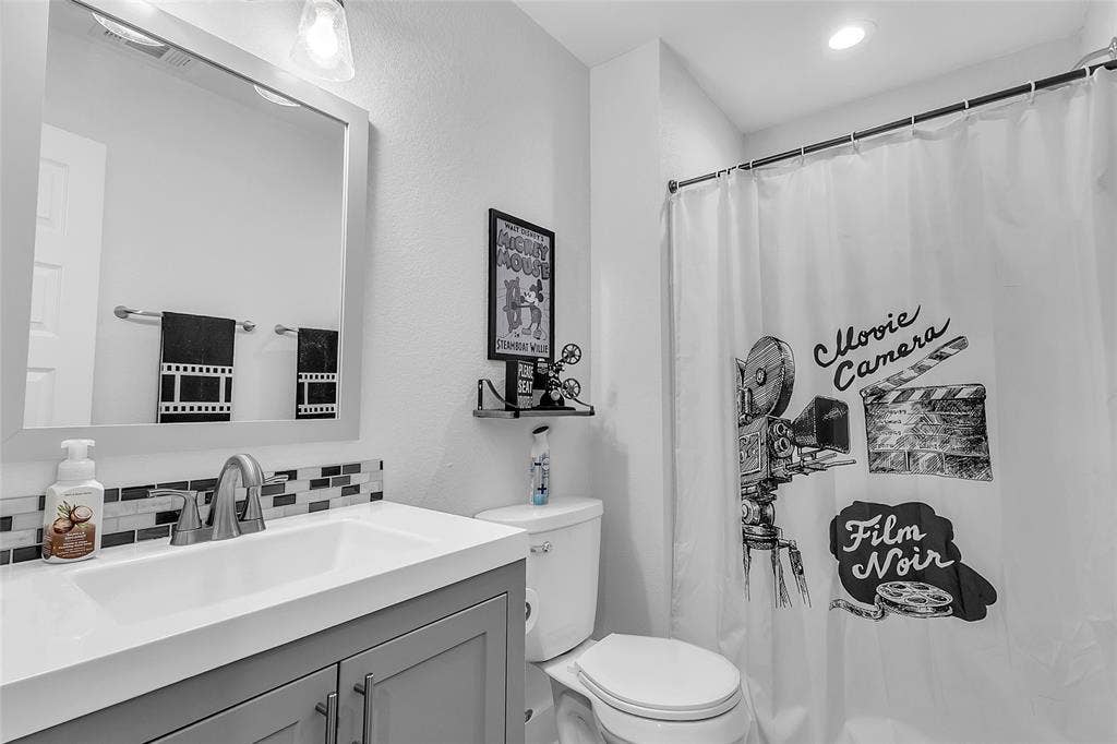 239 Colonial Drive, Mabank, TX 75156 The media room has its very own private bathroom whose movie themed accessories can remain