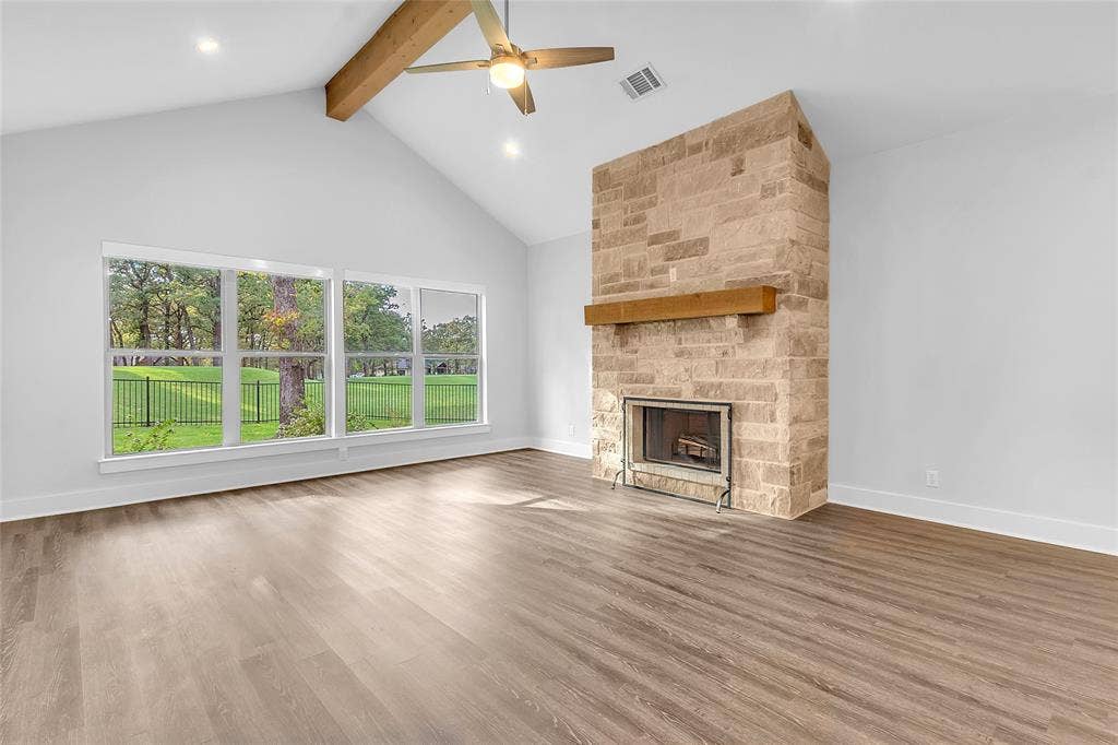 239 Colonial Drive, Mabank, TX 75156 Natural Stone Wood Burning Fireplace, tall ceilings, lots of natural light and peaceful views of the course