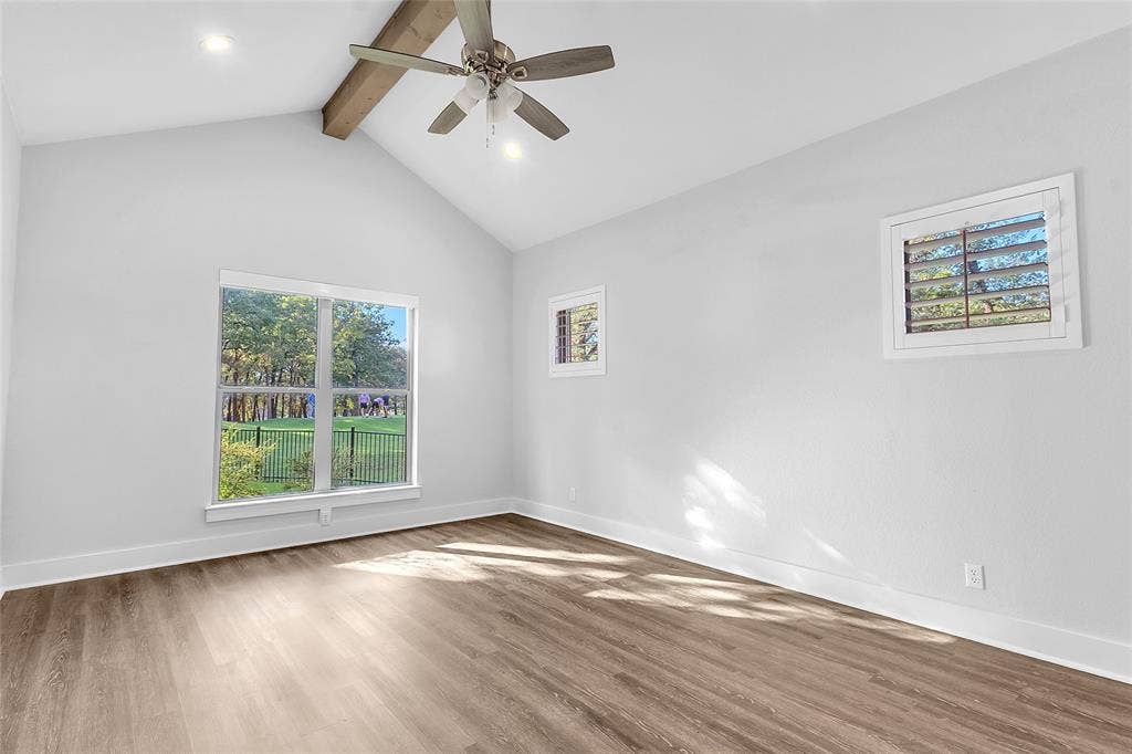 239 Colonial Drive, Mabank, TX 75156 A cathedral ceiling creates spaciousness enhanced by natural light and the windows are covered with remotely operated shades