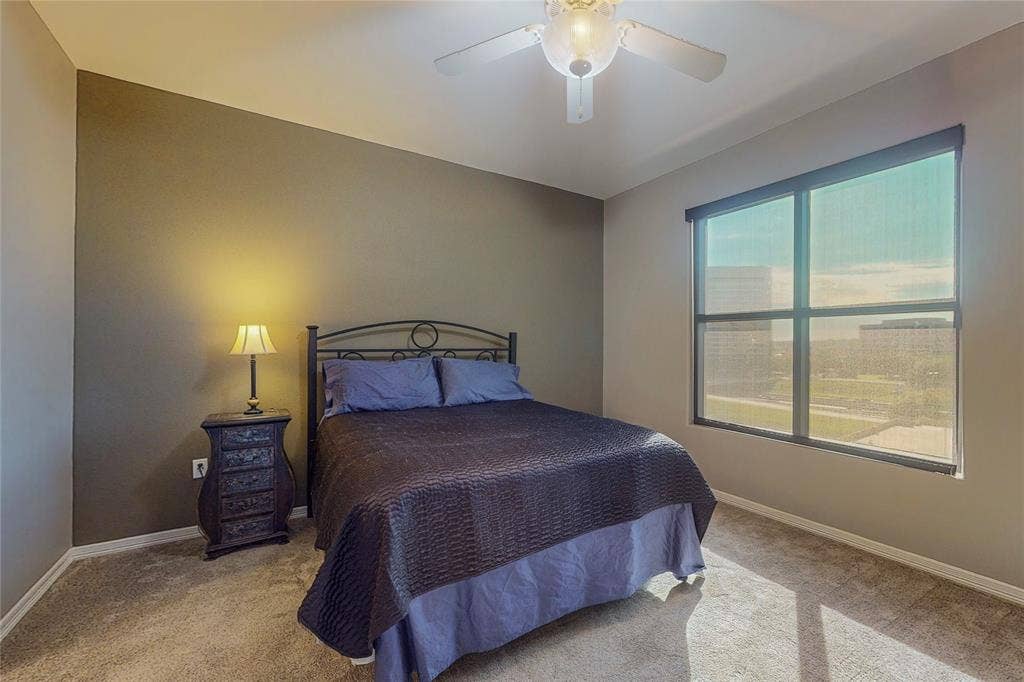 330 Las Colinas Boulevard E, #920, Irving, TX 75039 Carpeted bedroom featuring ceiling fan
