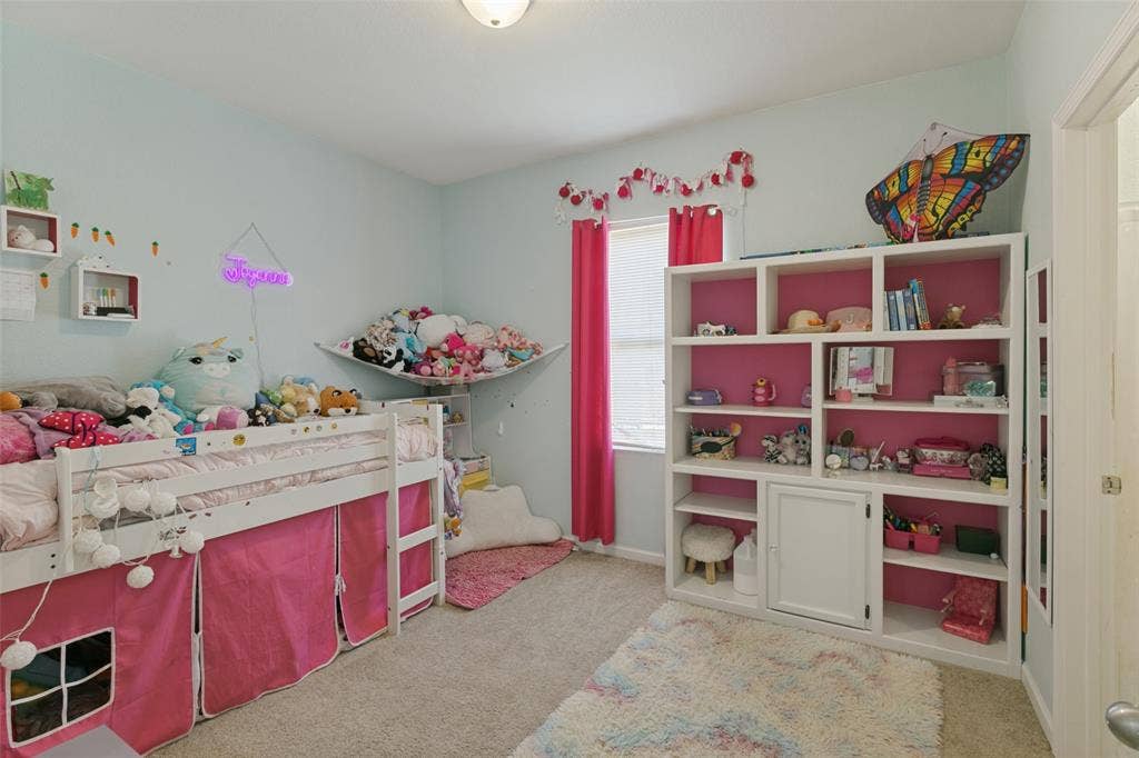 540 S Heights Drive, Crowley, TX 76036 Built-in white shelving unit with integrated lower cabinetry and neutral wall-to-wall carpeting