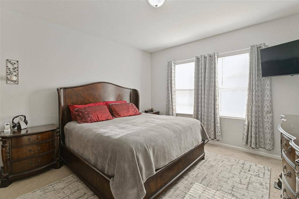 540 S Heights Drive, Crowley, TX 76036 Neutral-toned interior space featuring neutral wall-to-wall carpeting and two dual-pane windows with integrated hardware