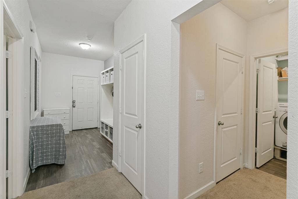540 S Heights Drive, Crowley, TX 76036 Interior entry area featuring wood-finish flooring, built-in shelving, white paneled doors, and recessed lighting