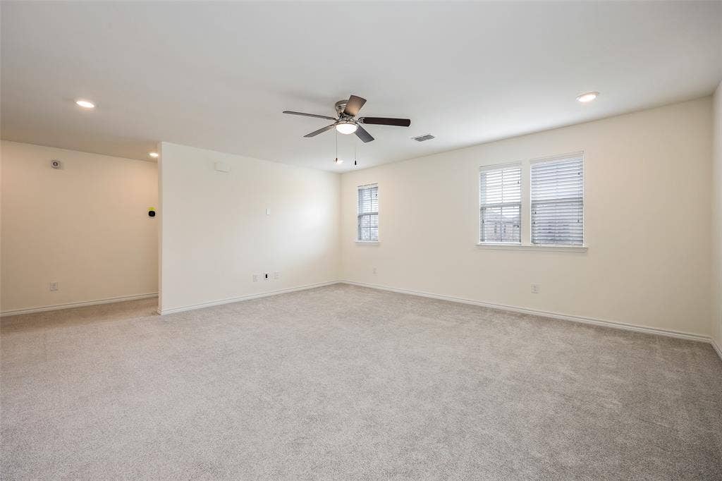 3681 Keechi Creek Drive, Celina, TX 75078 Interior space featuring neutral wall-to-wall carpeting, recessed lighting, and a multi-blade ceiling fan