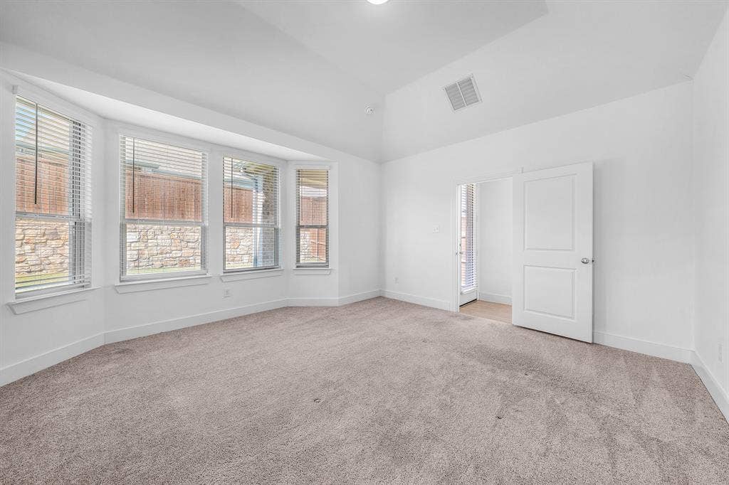 3800 Talisker Boulevard, Sherman, TX 75090 Spacious interior with neutral carpet flooring and white painted walls