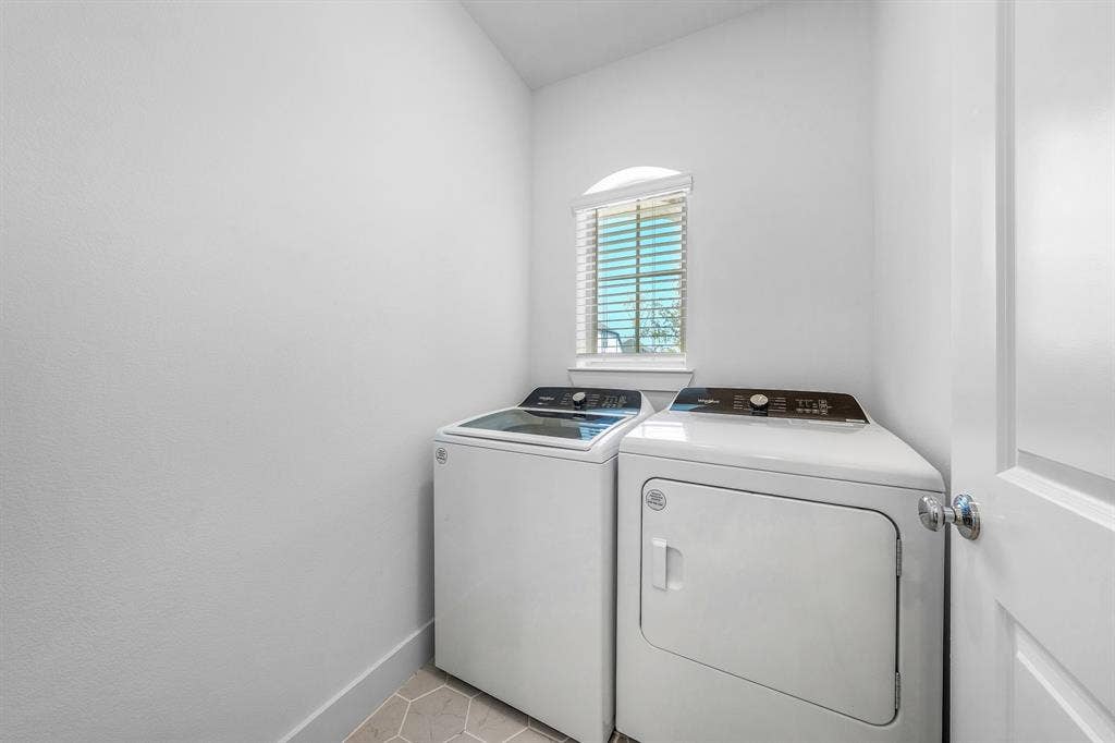3800 Talisker Boulevard, Sherman, TX 75090 Laundry room featuring an arched window with blinds and hexagonal tile flooring