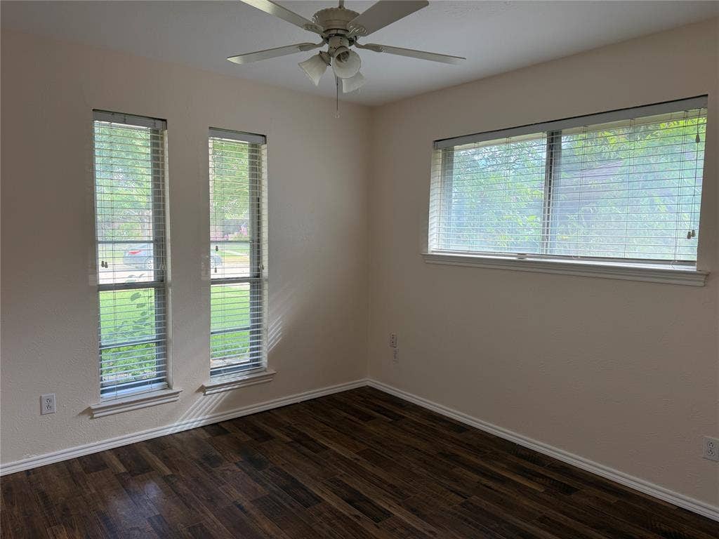 2408 Skiles Drive, Plano, TX 75075 Wood-finish flooring, multiple windows with blinds, and a ceiling fan with integrated lighting