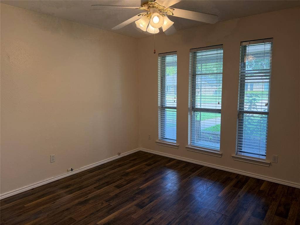 2408 Skiles Drive, Plano, TX 75075 Wood-finish flooring, three vertical windows with blinds, and ceiling fan with integrated lighting