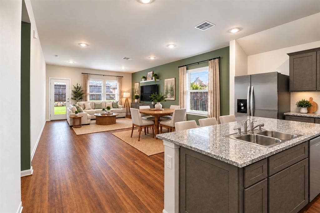 2316 French Street, Fate, TX 75189 Virtually staged kitchen, dining, and living areas