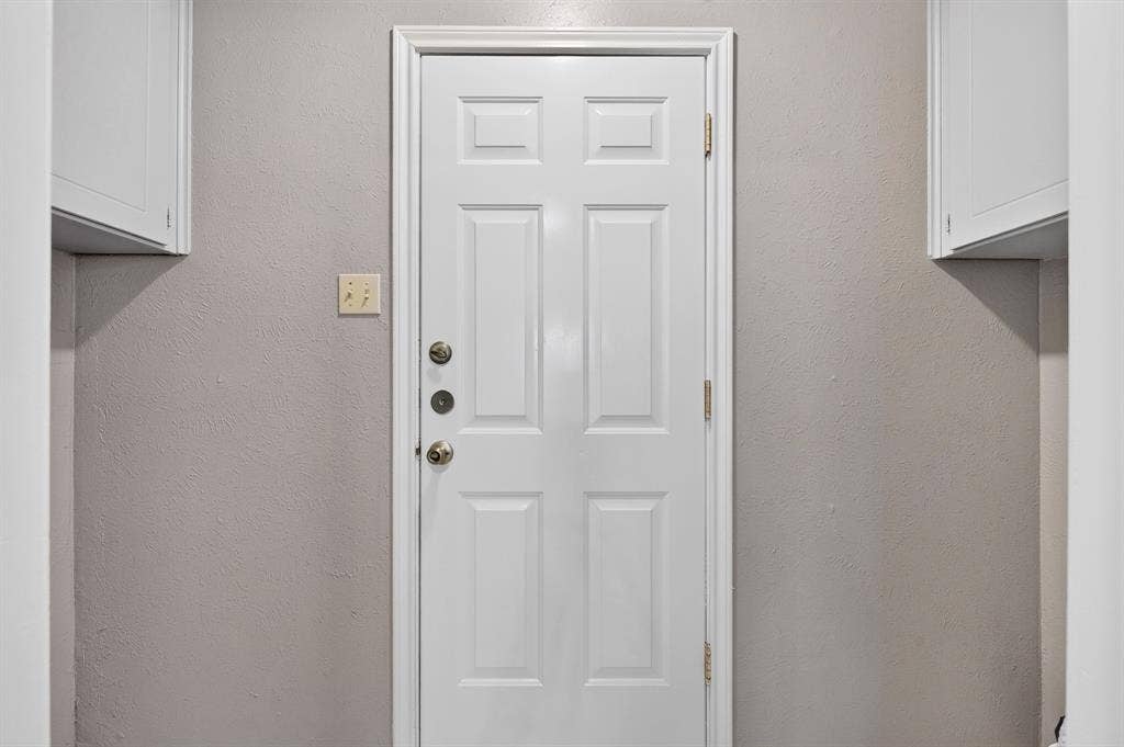 912 Shell Court, Bedford, TX 76022 White paneled door with three-point locking system
