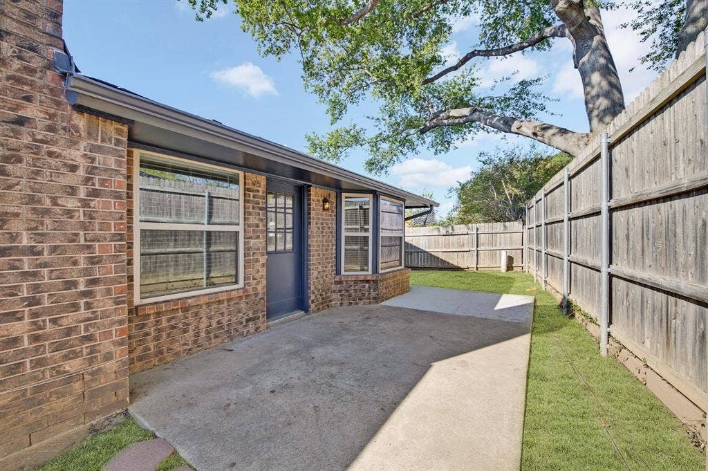 912 Shell Court, Bedford, TX 76022 Brick exterior with bay windows and a blue entry door
