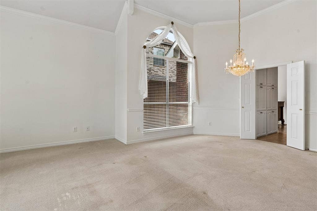 327 Hampton Court, Coppell, TX 75019 High ceilings, arched top window, crystal-style chandelier, and built-in cabinetry