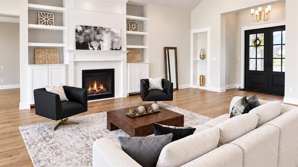 6651 Pinehurst Drive, Granbury, TX 76049 Built-in shelving and cabinetry flank a fireplace with a mantel
