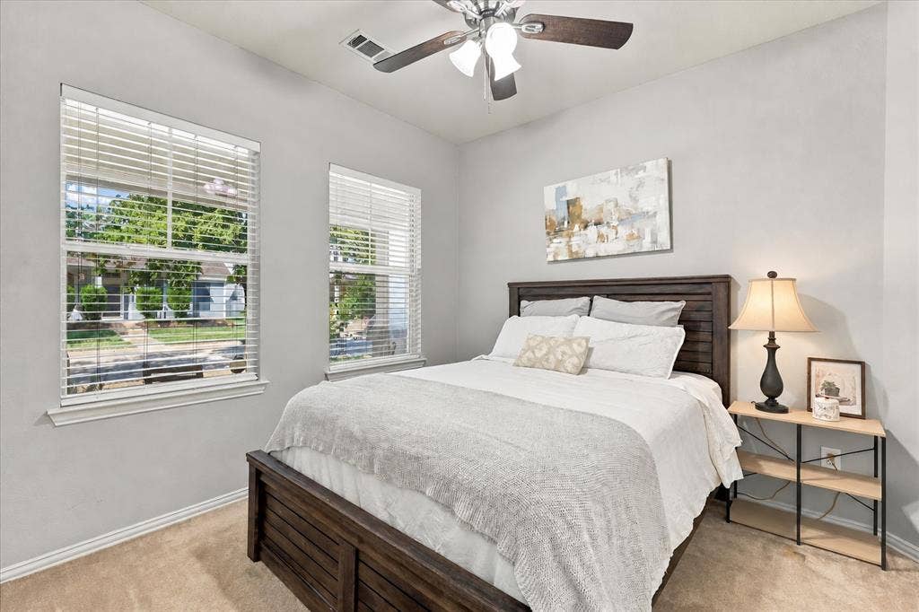 Secondary bedroom off the first level with split bathroom and natural light!