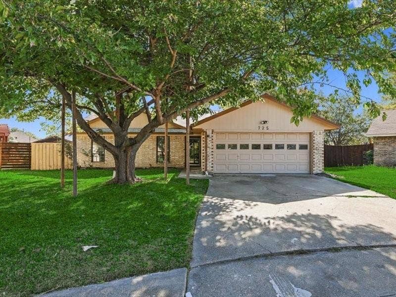 725 Southridge Court, Grand Prairie, TX 75052 Brick and siding exterior with a two-car garage