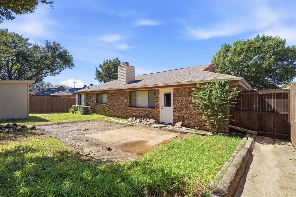 Brick exterior with a shingled roof