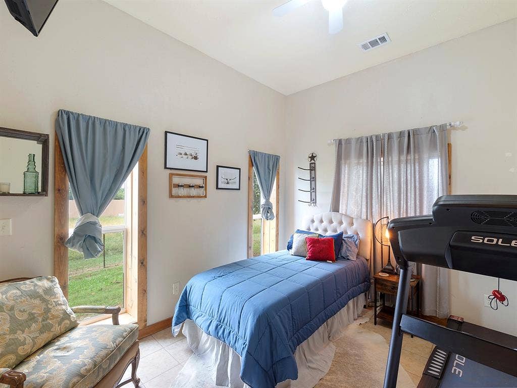 5801 County Road 4128, Scurry, TX 75158 High ceilings, tile flooring, and dual windows with wood trim