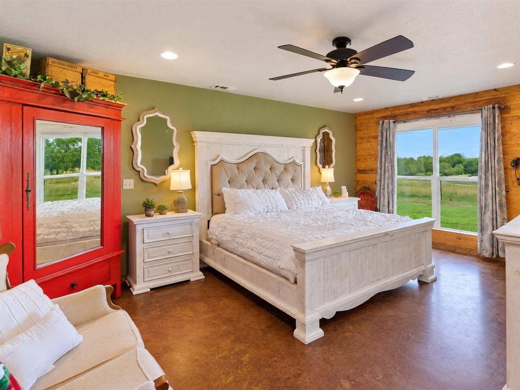 5801 County Road 4128, Scurry, TX 75158 Expansive window, recessed lighting, ceiling fan, wood-finish flooring, and wood panel accent wall