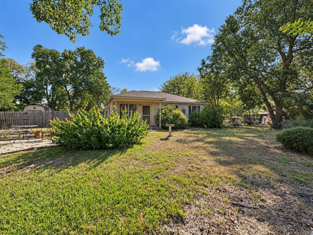 208 Olive Street, Lone Oak, TX 75453 Expansive lawn with mature trees and established perimeter fencing