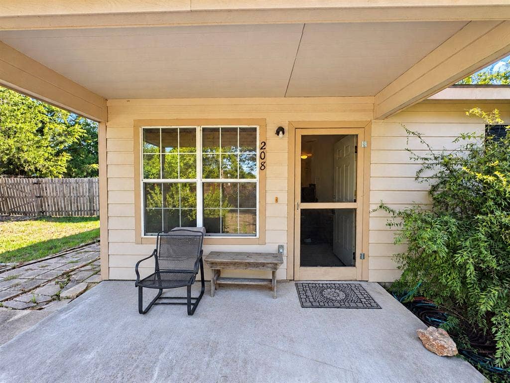 208 Olive Street, Lone Oak, TX 75453 Covered concrete patio with a screen door entry