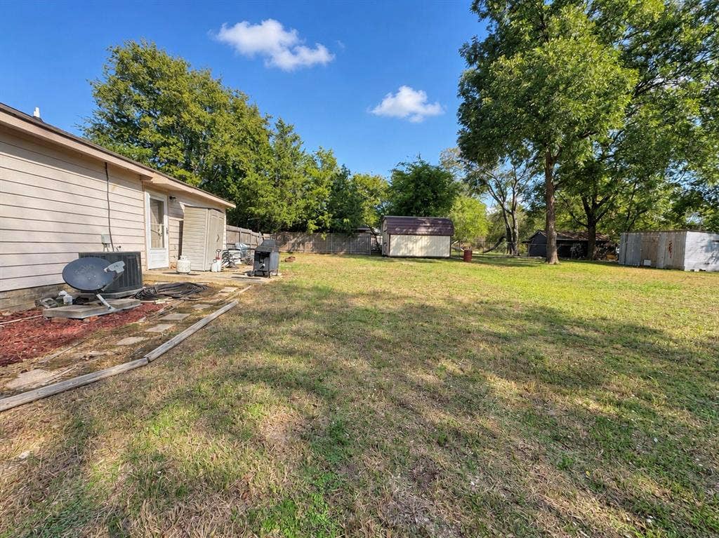 208 Olive Street, Lone Oak, TX 75453 Expansive grassy yard with mature trees