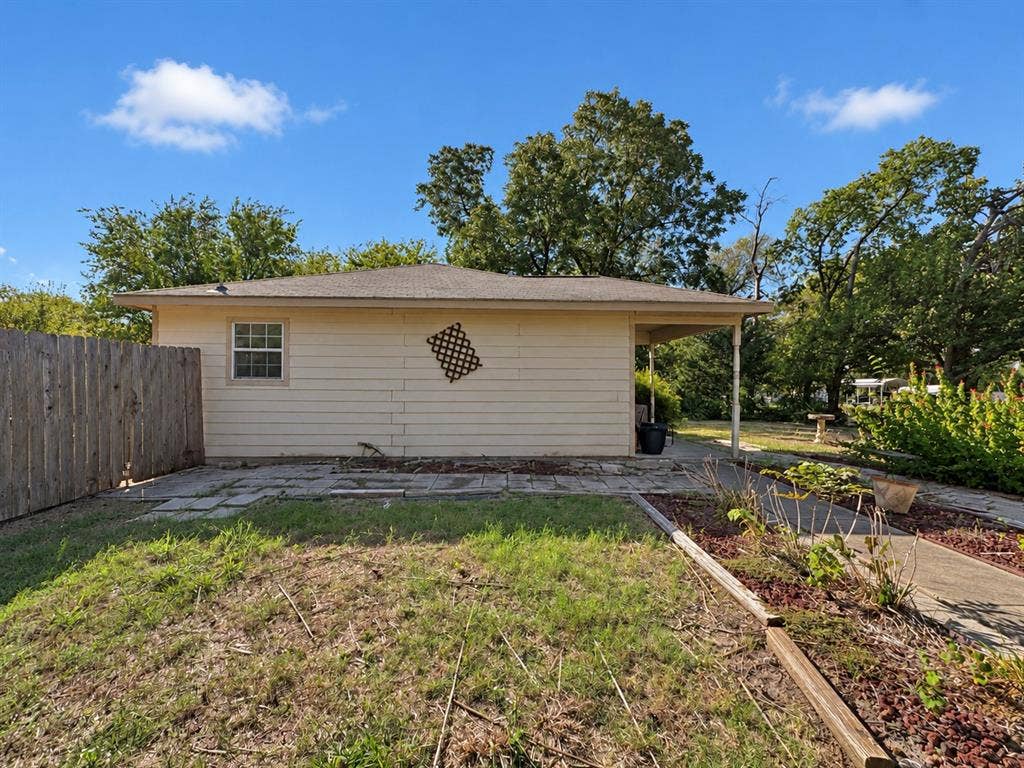 208 Olive Street, Lone Oak, TX 75453 Rear exterior with horizontal siding, a covered patio, and a privacy fence