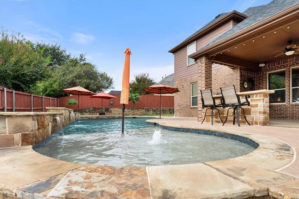 824 Rio Grande Drive, Mansfield, TX 76063 Large tanning deck with umbrella fitting.