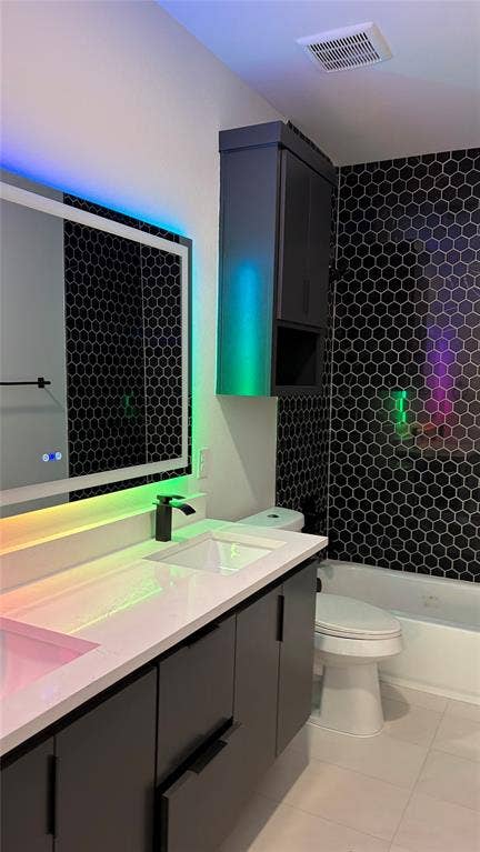 Modern vanity with a white countertop and rectangular undermount sink, complemented by a matte black faucet