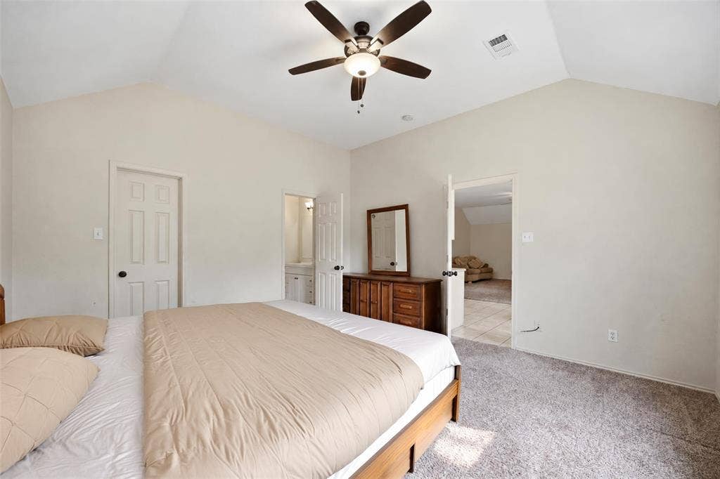 Large primary bedroom with en-suite bathroom and walk-in closet