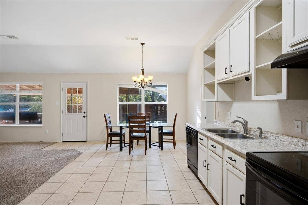 The breakfast room looks out to the backyard and covered patio