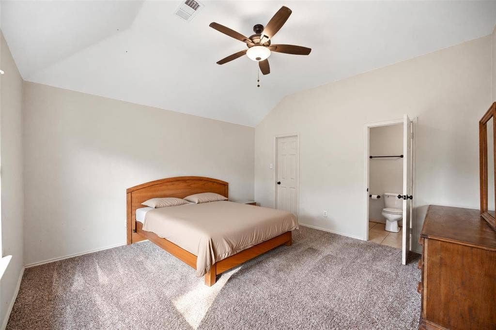 Large primary bedroom with en-suite bathroom and walk-in closet