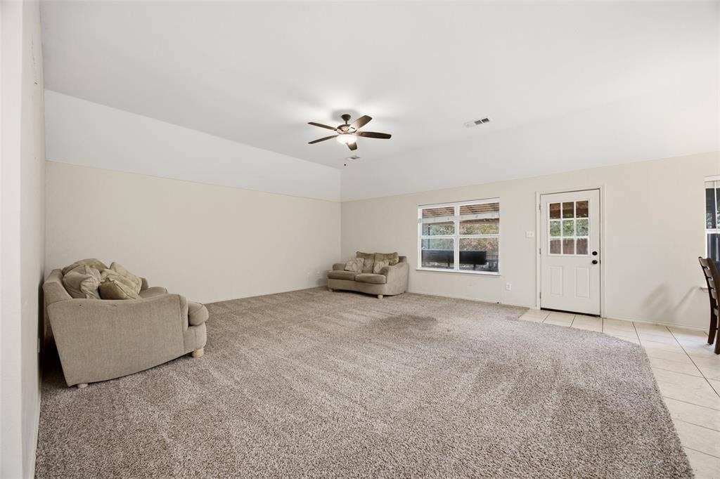 Large living room with tall ceiling