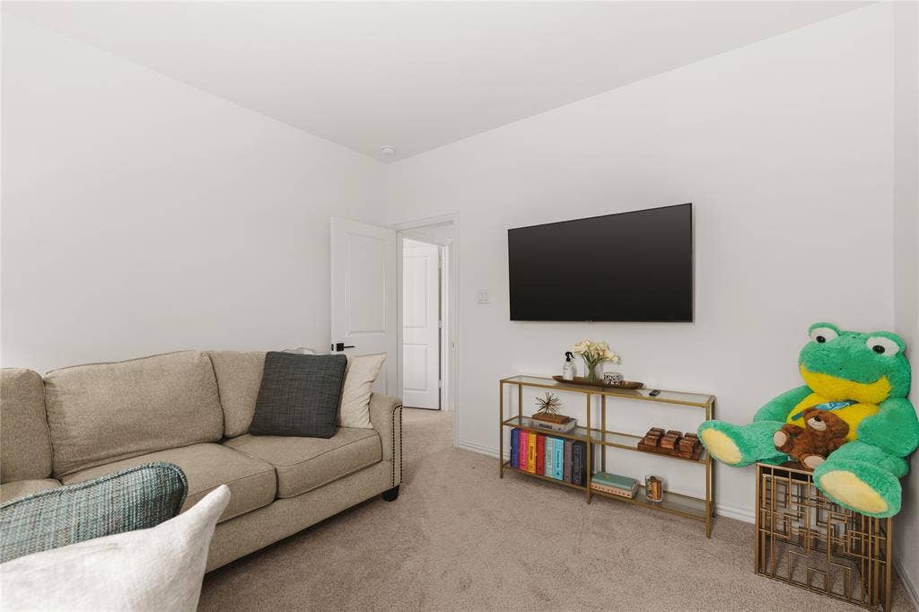 1456 Martingale Lane, Forney, TX 75126 Neutral-toned wall-to-wall carpeting and crisp white interior paint finish