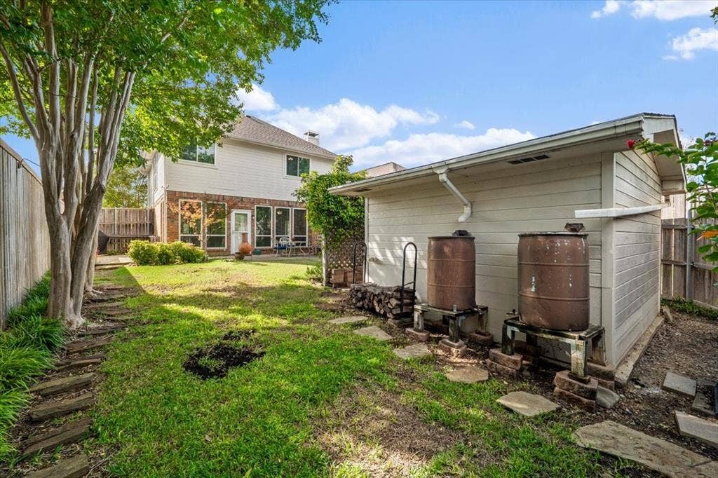 2 rain barrels for special watering - a gardeners paradise