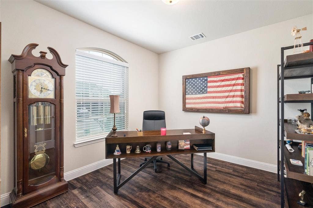 1017 Hoyt Drive, McKinney, TX 75071 Arch-top window with blinds, wood-finish flooring, and crown molding
