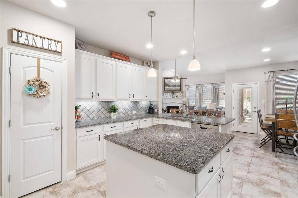 1017 Hoyt Drive, McKinney, TX 75071 Kitchen featuring white shaker cabinetry, granite countertops, a tiled backsplash, and recessed lighting