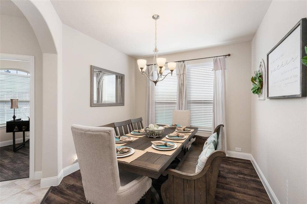 1017 Hoyt Drive, McKinney, TX 75071 Recessed lighting accents a spacious dining area with wood-finish flooring