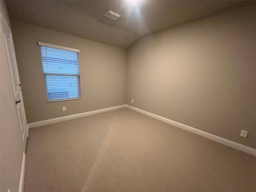 5908 Brittner Drive, Princeton, TX 75071 Neutral-toned carpeting with light-colored walls